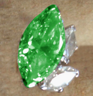 Enlarged photo of one of the stolen emerald earrings.